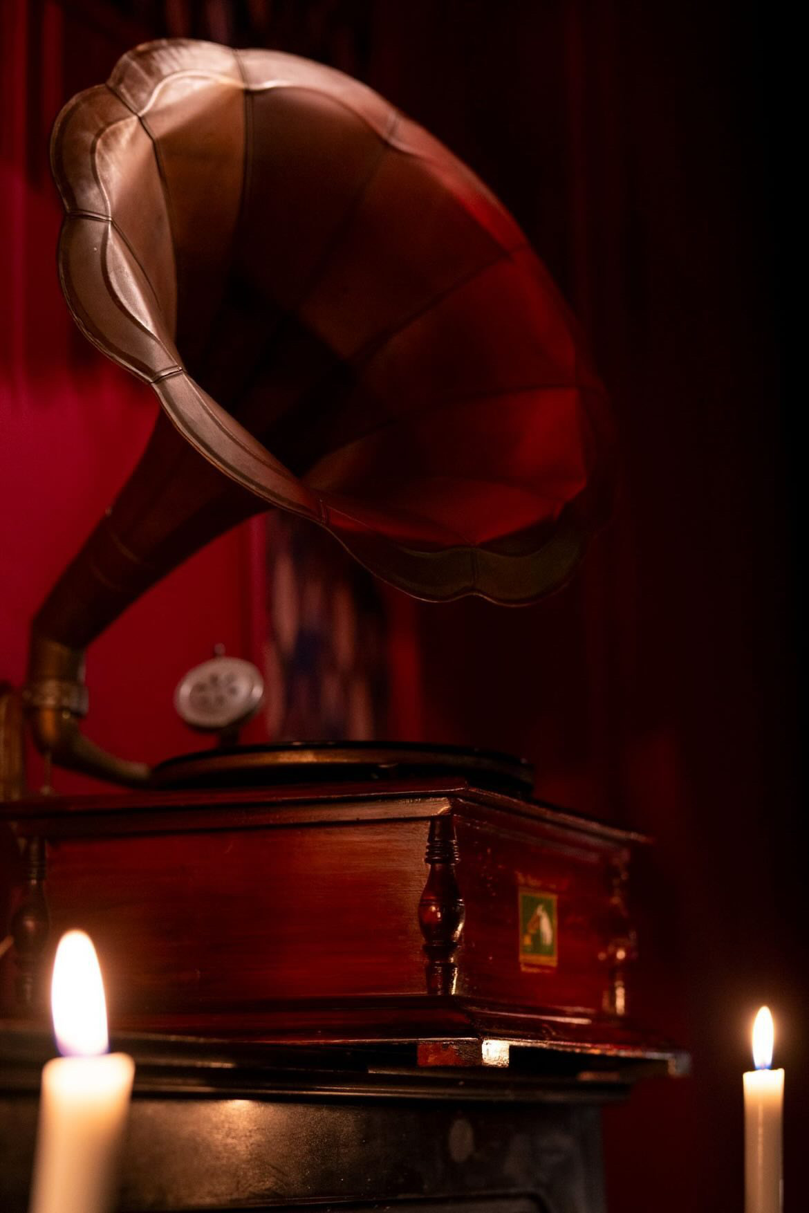 Antique gramophone lit in red